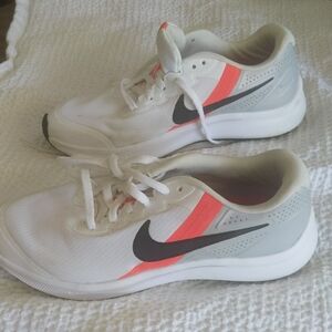 White and Gray Sneakers with Black and Orange Accents